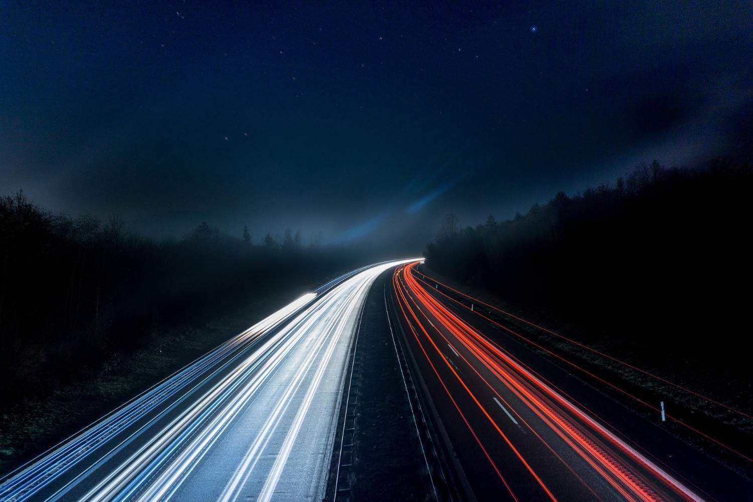 highway with light trails at night